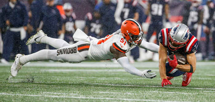 Browns linebacker Mack Wilson dives to tackle Patriots wide receiver Julian Edelman during a 2019 game. Wilson was on the verge of breaking out as the next Browns star linebacker, but he was traded to the Patriots in 2022.